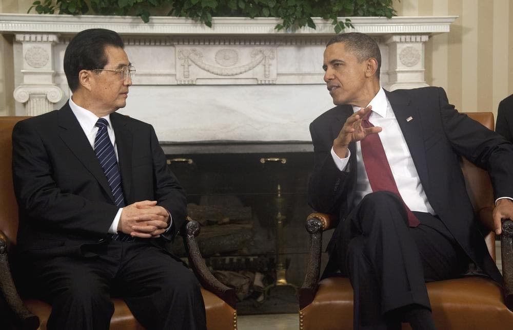 President Barack Obama meets with China's President Hu Jintao in the Oval Office of the White House ahead of a state dinner Wednesday night. (AP)
