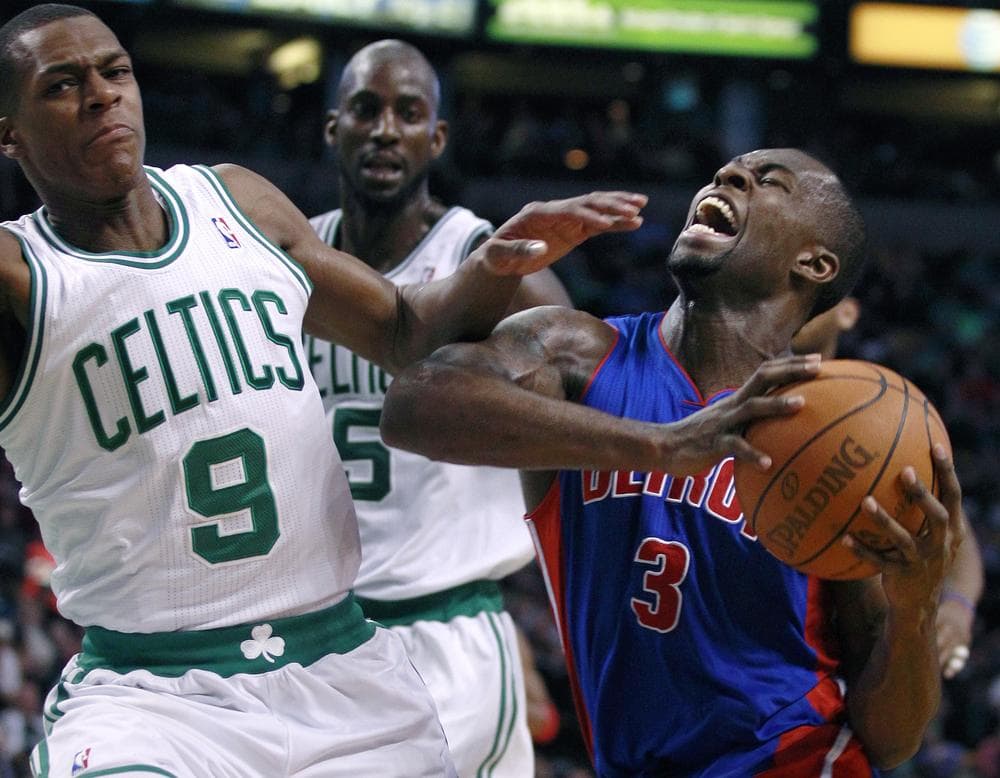 Detroit Pistons guard Rodney Stuckey, right, yells as he collides with Boston Celtics guard Rajon Rondo, left, on a drive to the basket during the second half of an NBA basketball game in Boston, Wednesday, Jan. 19, 2011. Stuckey had 15 points as the Celtics beat the Pistons 86-82. At rear center is Celtics forward Kevin Garnett.(AP)