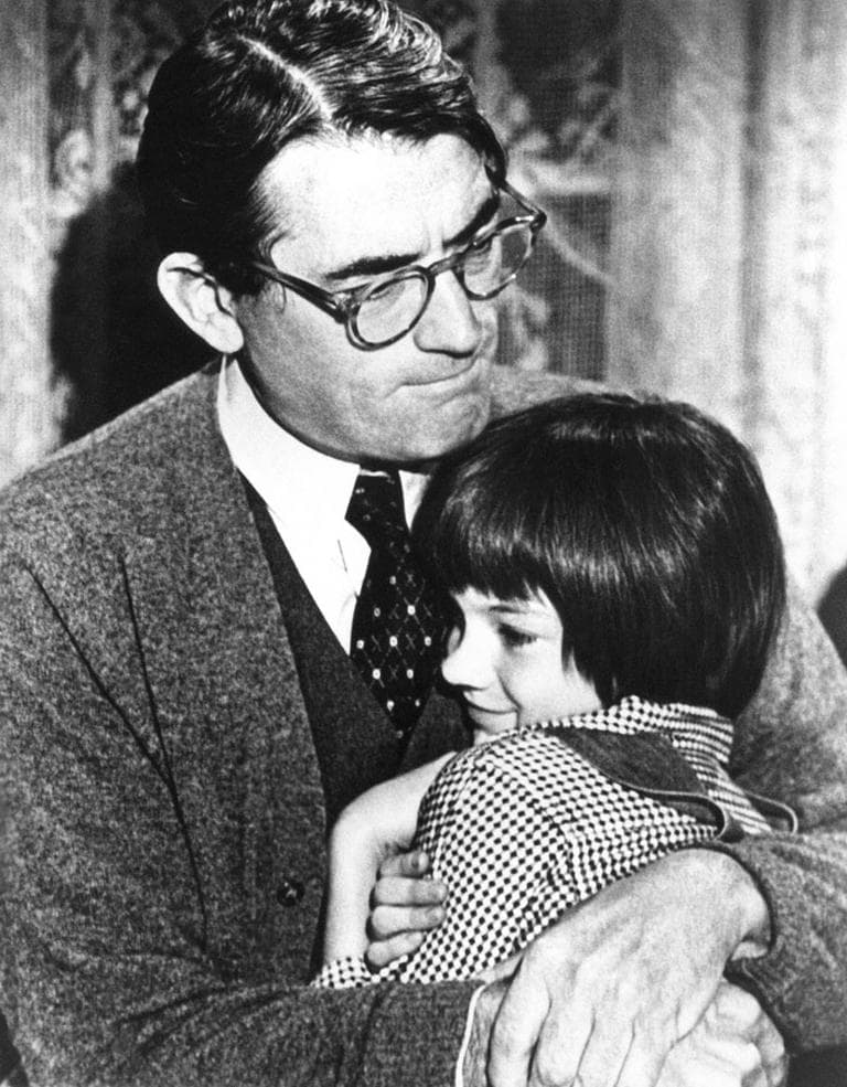 Gregory Peck, as Atticus Finch, embraces Mary Badham, or Scout, in the 1962 “To Kill a Mockingbird” film. (AP)
