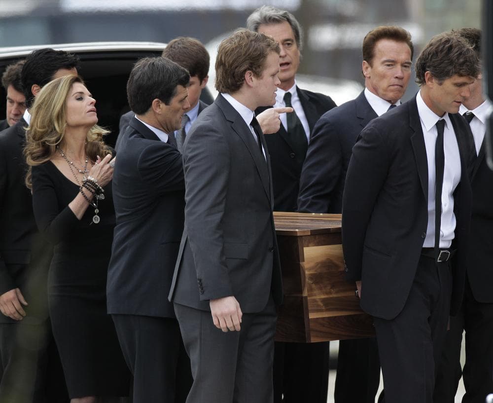The casket of R. Sargent Shriver is carried into Our Lady of Mercy Catholic Church for a funeral Mass in Potomac, Md., Saturday. His son, Anthony Shriver, is at far right. His daughter, Maria Shriver, is at left, joined by her husband, former Calif. Gov. Arnold Schwarzenegger, second from right. (AP)