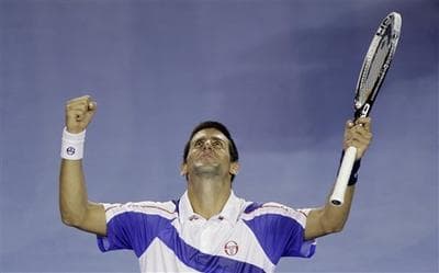Serbia's Novak Djokovic celebrated his win over Switzerland's Roger Federer in their semifinal at the Australian Open tennis championships in Melbourne, Australia. (AP)