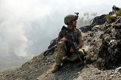Sergeant Brendan O'Byrne of Second Platoon, Battle Company awaits for a helicopter supply drop at Outpost Restrepo, in the Korengal Valley, Kunar Priovince, Afghanistan. (© Outpost Films/ 2010 Tim Hetherington, from the award winning documentary, &quot;Restrepo.&quot;)