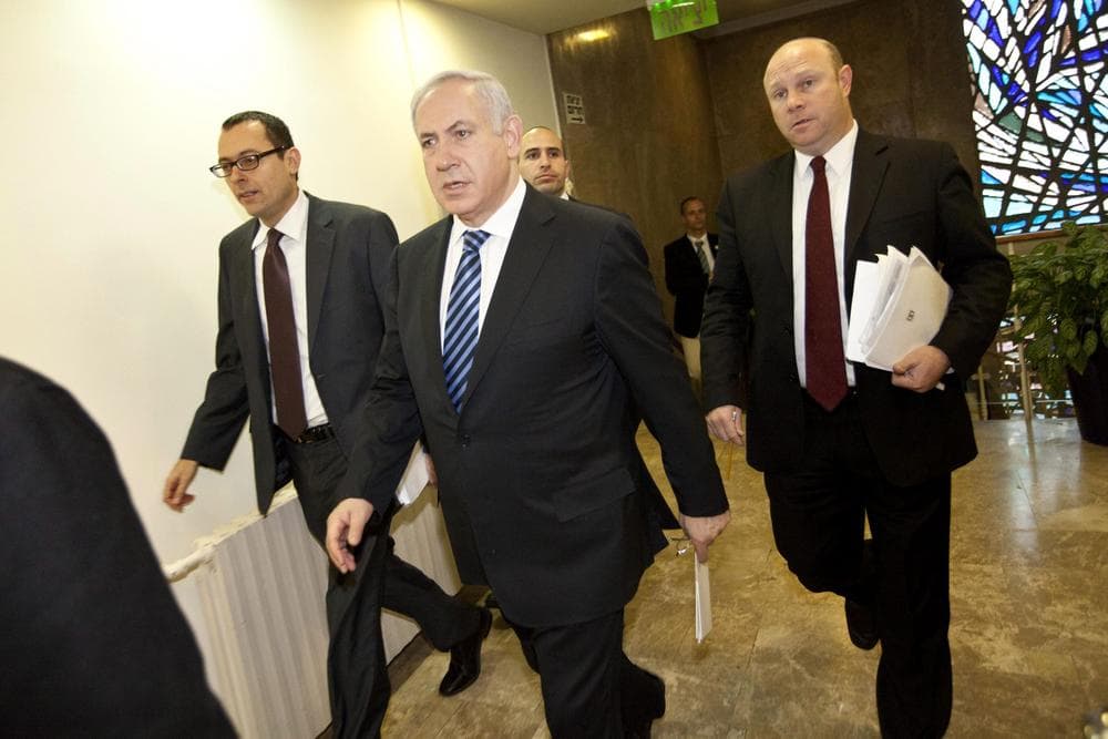 Israeli Prime Minister Benjamin Netanyahu, center, arrives at the weekly cabinet meeting in Jerusalem, Sunday, Jan. 30, 2011.  (AP Photo/Tomer Appelbaum, Pool)