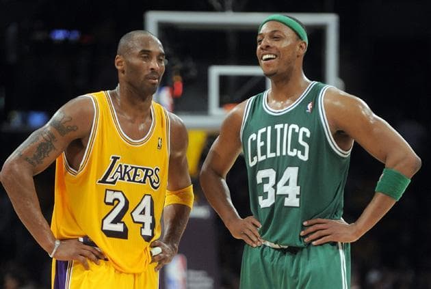 Los Angeles Lakers guard Kobe Bryant, left, listens to Boston Celtics forward Paul Pierce during the final seconds of an NBA basketball game in Los Angeles on Sunday. The Celtics won 109-96. (AP)