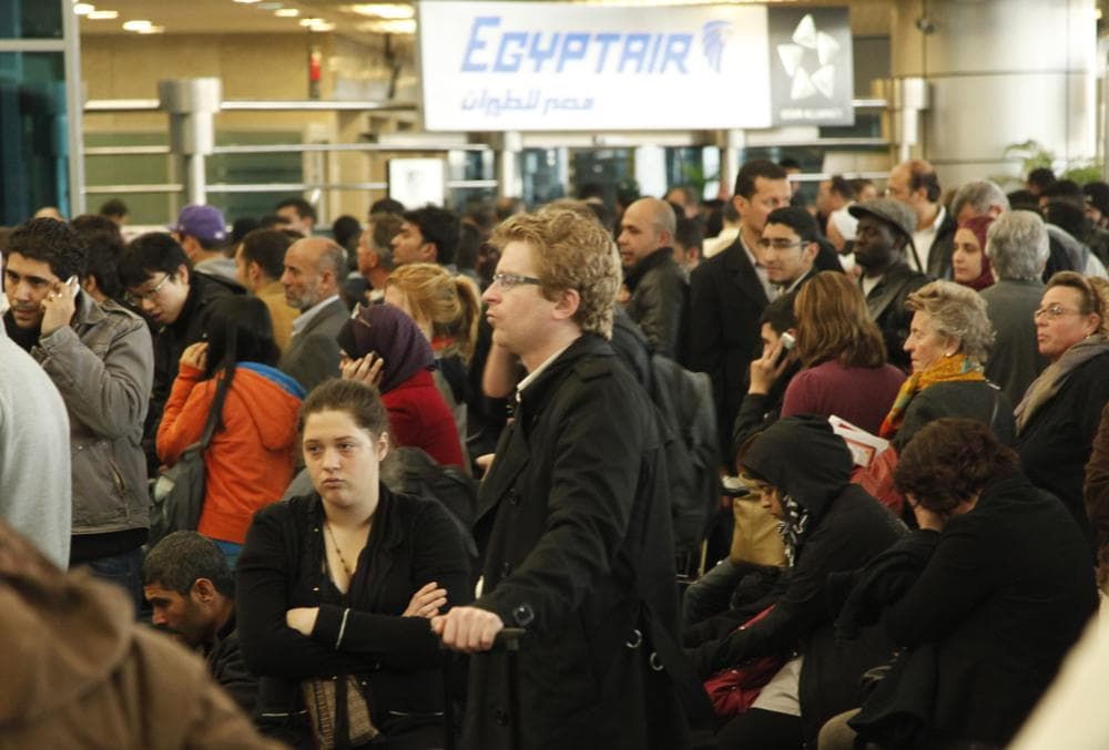 Passengers wait for check-in at Cairo's international airport, outside Cairo, Egypt. (AP)