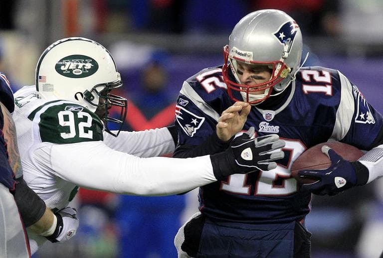 New York Jets Shaun Ellis sacks New England Patriots quarterback Tom Brady during the NFL divisional playoff football game. (AP)
