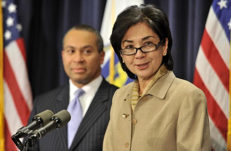 Gov. Deval Patrick looks on at Appeals Court Justice Fernande Duffly during a news conference at the State House Dec. 21, 2010. (AP)