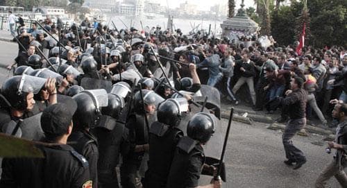 Police face demonstrators in Cairo, Jan. 25, 2011, during a Tunisia-inspired demonstration. (AP)