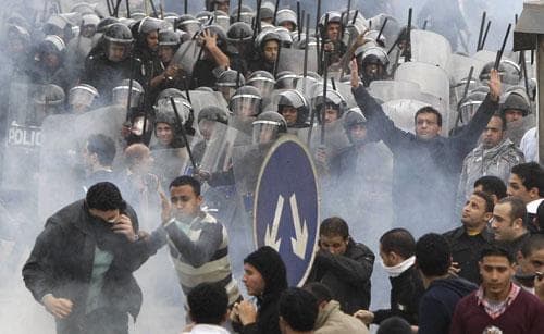 Egyptian anti-government activists clash with riot police in Cairo, Egypt, Friday, Jan. 28, 2011. (AP)