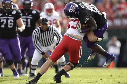 TCU wide receiver Jimmy Young (88) is stopped by Wisconsin linebacker Mike Taylor (53) during the first half of the Rose Bowl, Jan. 1, 2011, in Pasadena, Calif. (AP)