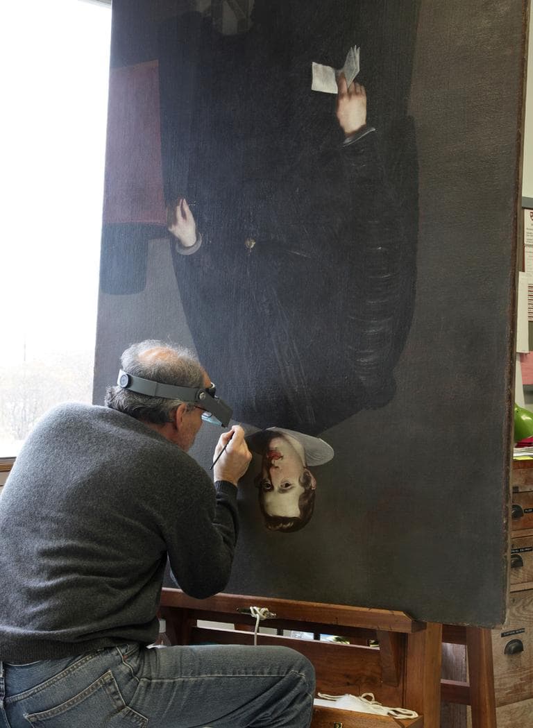 A museum worker during the restoration process. (Courtesy of the Isabella Stewart Gardner Museum)