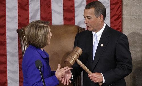 Outgoing Speaker Nancy Pelosi of California hands the gavel to Speaker-elect John Boehner of Ohio, Jan. 5, 2011. (AP)