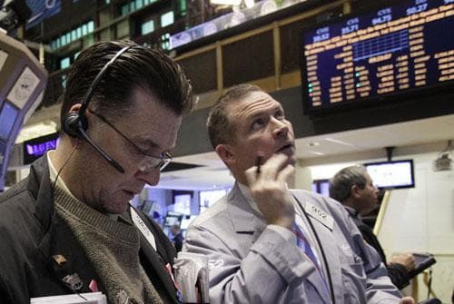 A pair of traders work on the floor of the New York Stock Exchange, Jan. 28, 2011. (AP)
