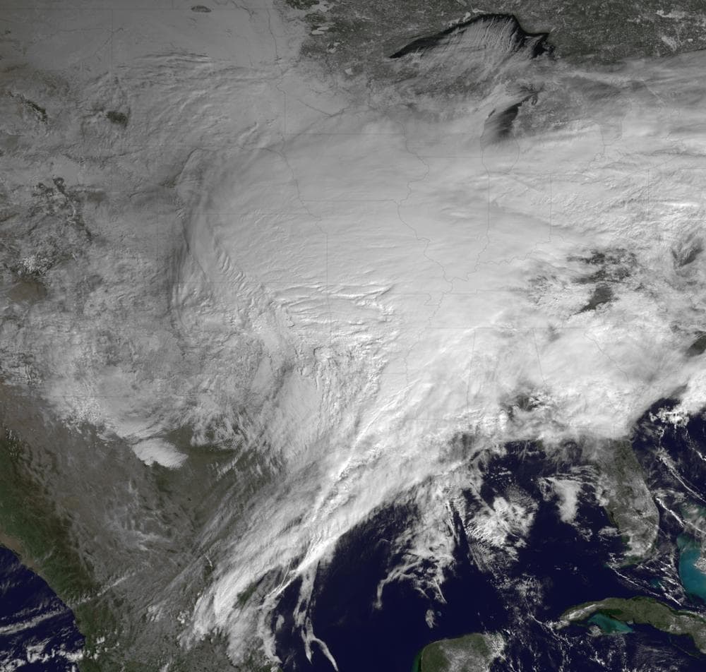 This satellite image shows a huge swath of the United States affected by a winter storm that's more than 2,000 miles in reach and has already caused roads and airports to close from Texas to Rhode Island. (AP/NOAA)