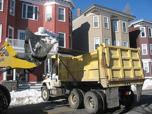 Trucks moved snow off the streets and to &quot;snow farms&quot; in South Boston Wednesday. (Monica Brady-Myerov/WBUR)