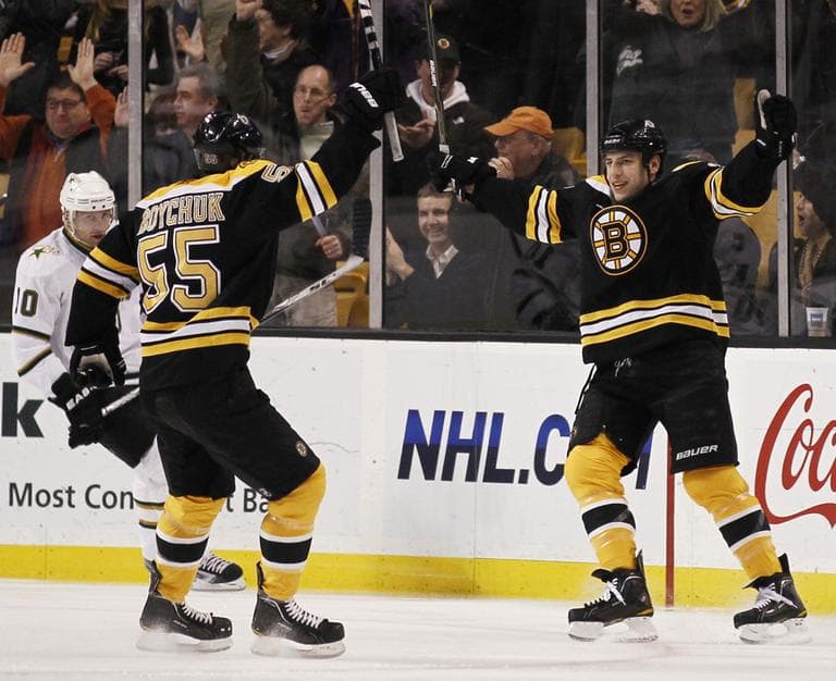 Boston Bruins&#039; Milan Lucic, right, celebrates his goal with teammate Johnny Boychuck as Dallas Stars&#039; Brendan Morrow, left, looks on during the first period of Boston&#039;s 6-3 win in an NHL hockey game in Boston on Thursday, Feb. 3, 2011. (AP Photo/Winslow Townson)