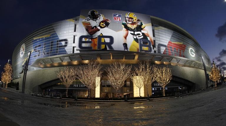 Despite surprising freezing Cowboys Stadium is lit up during the week leading up to the Super Bowl. (AP)
