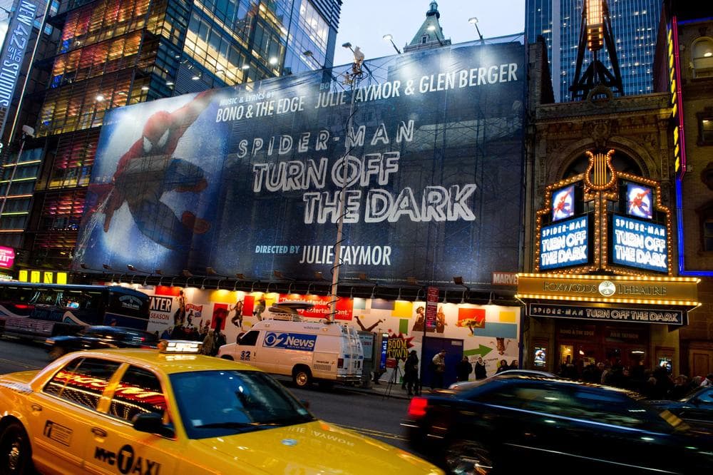 A billboard and the marquee for the Broadway musical 'Spider-Man Turn: Off the Dark' are seen outside the Foxwoods Theatre on West 42nd Street in New York. (AP)
