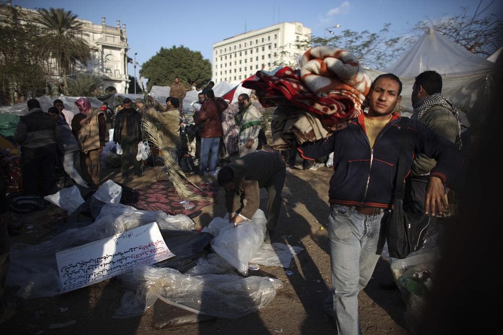 Egyptians break down their makeshift camps in Tahrir Square in downtown Cairo, Egypt, Saturday, Feb. 12, 2011.  (AP)