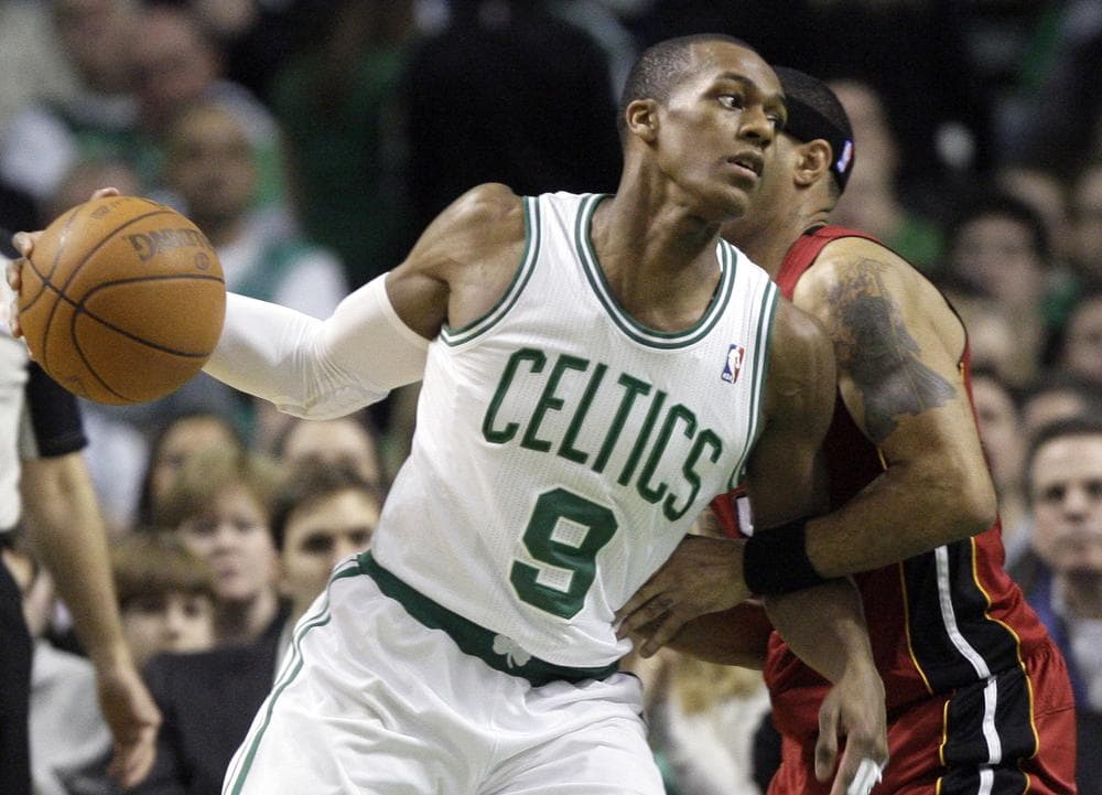 Boston guard Rajon Rondo drives past Miami guard Eddie House, right, in the first half of the game in Boston, Sunday. Rondo had a triple-double with 11 points, 10 assists and 10 rebounds as the Celtics won 85-82. (AP)