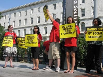 Protesters demonstrate in front of the Republican National Headquarters against a proposal to privatize Social Security in 2008. (TalkMediaNews/Flickr)