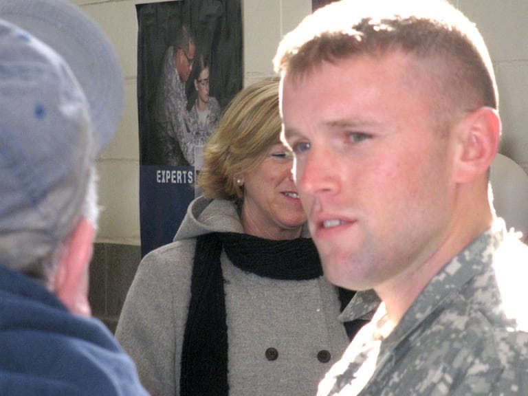 Sgt. Chris Mutrie, 28, of Barnstable, just back from his first deployment, talks to his parents. (Fred Thys/WBUR)