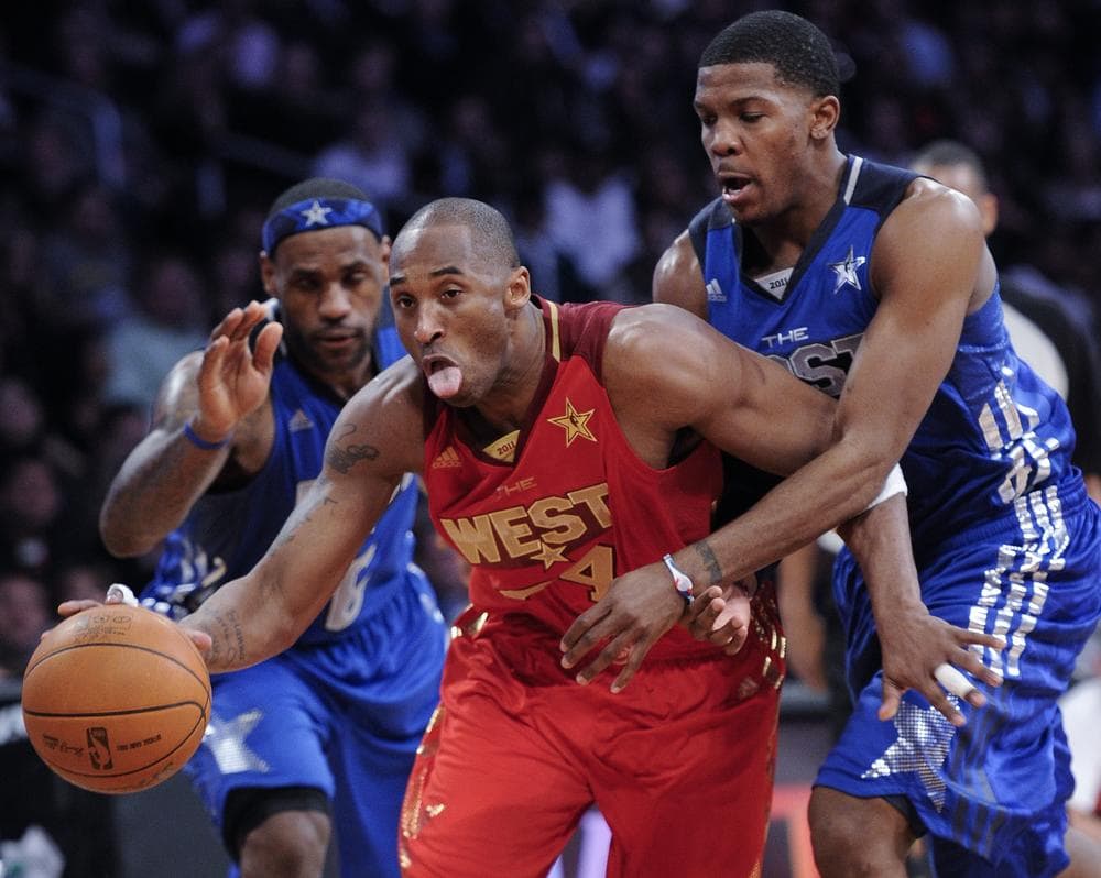 West's Kobe Bryant, of the Los Angeles Lakers, drives past East's LeBron James, left, of the Miami Heat, and Joe Johnson, of the Atlanta Hawks, during the second half of the NBA basketball All-Star Game on Sunday in Los Angeles. (AP) 