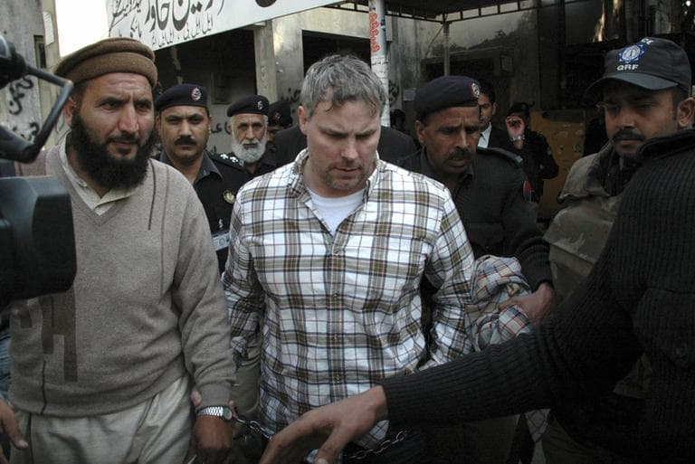 In this Jan. 28 file photo, Pakistani security officials escort Raymond Allen Davis, a U.S., center, to a local court in Lahore, Pakistan. (AP)