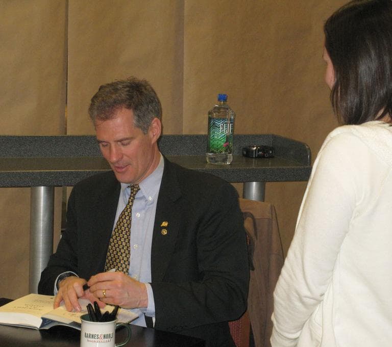Sen. Scott Brown signed his memoir in Boston Tuesday. (Fred Thys/WBUR)