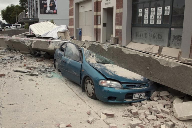 A car is crushed by a beam in central Christchurch, New Zealand, Tuesday. (AP)