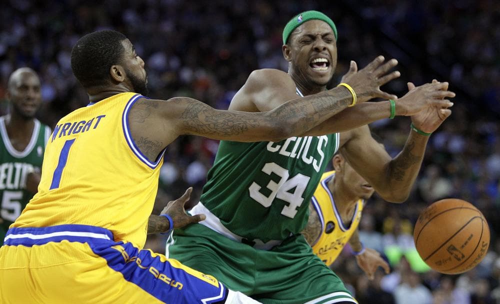 Boston Celtics' Paul Pierce (34) and Golden State Warriors' Dorell Wright, left, fight for the ball during the second half of an NBA basketball game on Tuesday in Oakland, Calif. (AP)