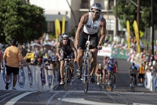 When people train to compete in events like the 2008 Ironman World Championship in Kailua-Kona, Hawaii, is it hurting their marriages? (AP)
