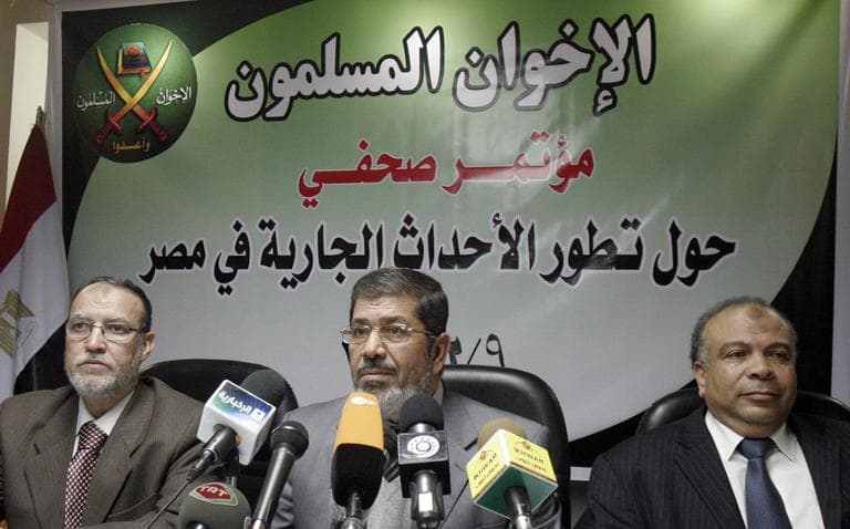 Senior members of Egypt's Muslim brotherhood Saad el-Katatni, right, Mohamed Morsi, and Essam el-Erian hold a press conference in Cairo, Wednesday, Feb. 9. (AP)