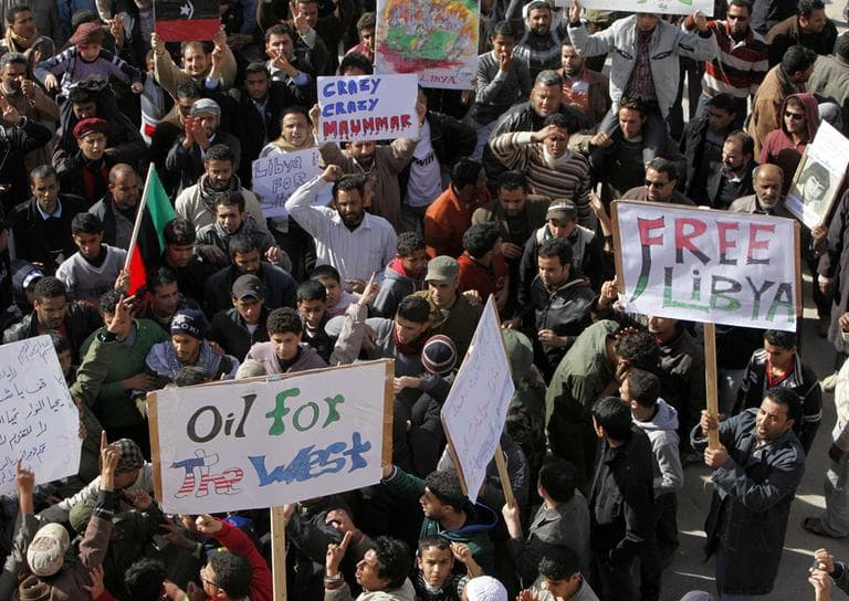 Libyan protesters shout slogans against Libyan leader Moammar Gadhafi during a demonstration in Tobruk, Libya, Wednesday. (AP)