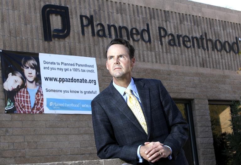 Bryan Howard, President and CEO of Planned Parenthood Arizona, Inc., poses in front of a Planned Parenthood facility in Tucson, Ariz. (AP)