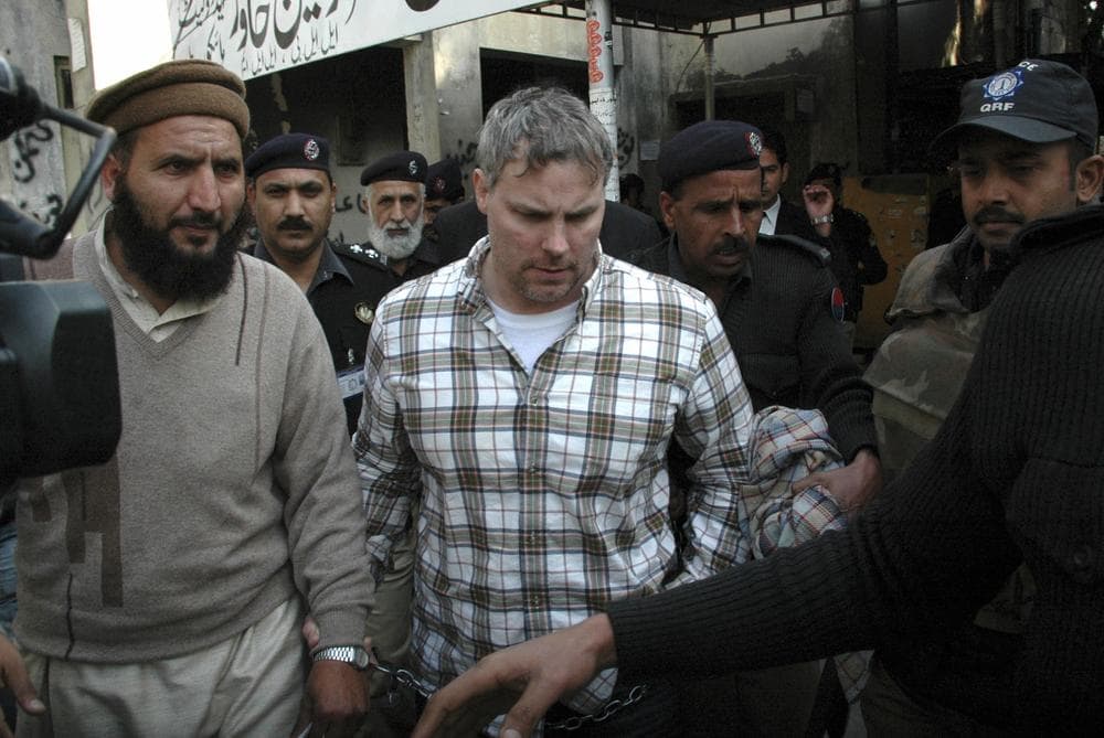 Pakistani security officials escort Raymond Allen Davis, a U.S. consulate employee, center, to a local court in Lahore, Pakistan. (AP)