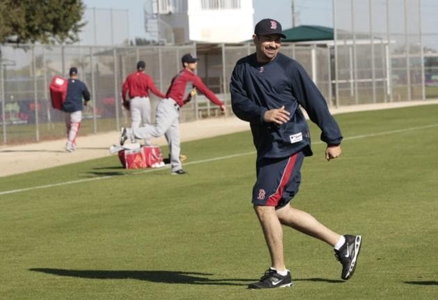 New first baseman Adrian Gonzalez loosens up at the Red Sox training facility in Fort Myers, Fla. (AP)