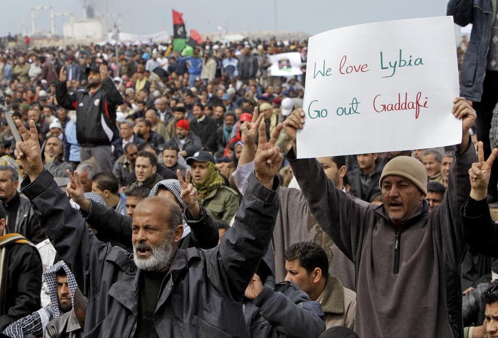 Libyan protesters shout slogans against Libyan Leader Moammar Gadhafi during a demonstration at the court square, in Benghazi, Libya. (AP)