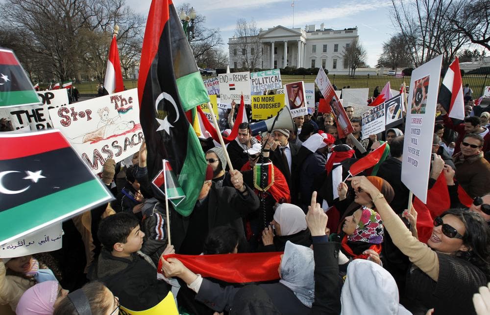 Protestors waving the 1951 first national flag of modern Libya gather in front of the White House in Washington, Saturday, Feb. 26, 2011 condemning Libyan leader Moammar Gadhafi and calling for his ouster. (AP)