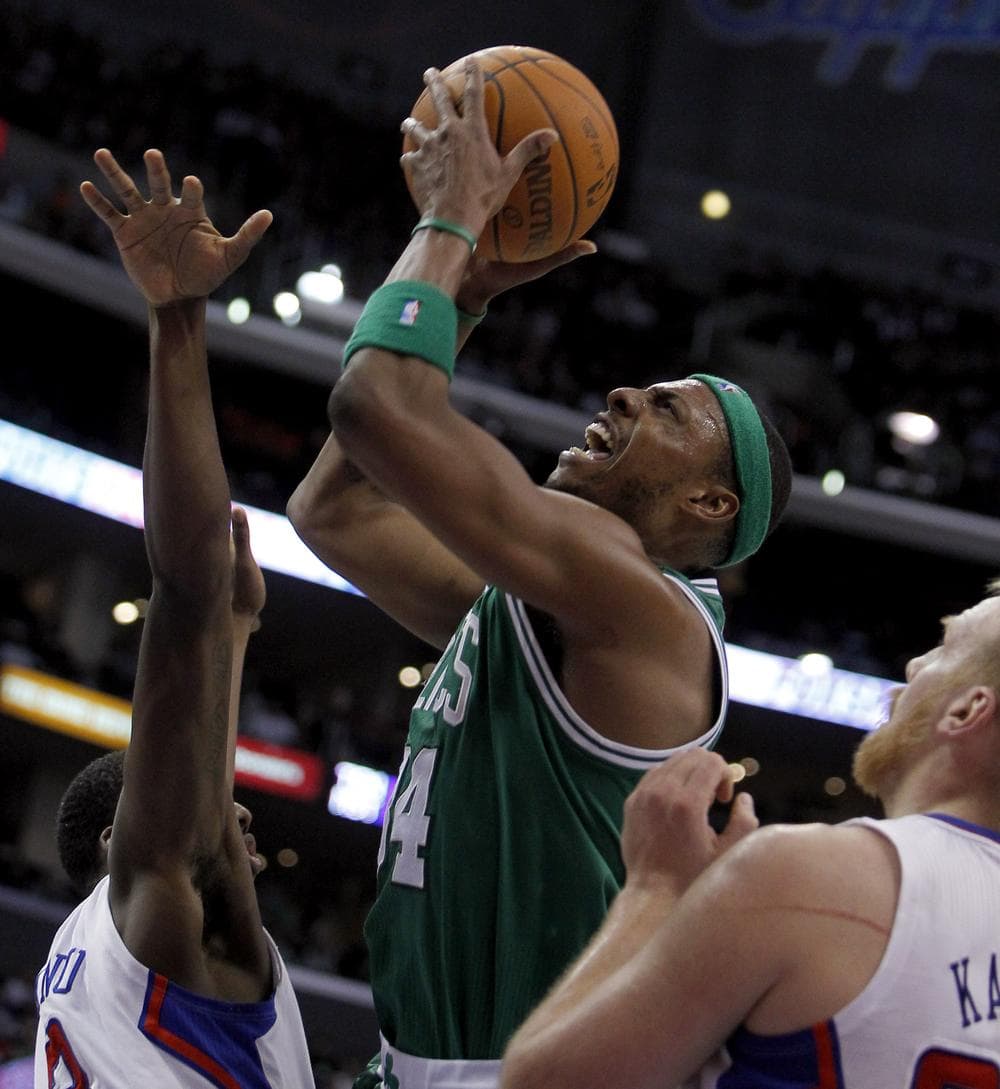 Celtics forward Paul Pierce shoots over Los Angeles Clippers forward Al-Farouq Aminu, left, with center Chris Kaman, right, defending during the second half Saturday in Los Angeles. (AP)