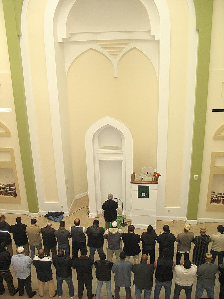 Men stand shoulder-to-shoulder during the call to prayer. (Martha Bebinger/WBUR)