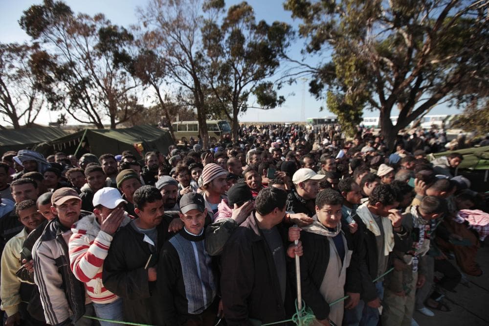 Egyptians who worked Libya and fled the unrest in the country wait to register as they arrive at a refugee camp set up by the Tunisian army, at  the Tunisia-Libyan border, in Ras Ajdir, Tunisia. (AP)