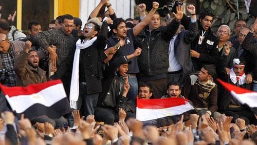 Egyptian Wael Ghonim, center, a 30-year-old Google Inc. marketing manager who was a key organizer of the online campaign that sparked the first protest on Jan. 25, talks to the crowd in Tahrir Square, in Cairo, Egypt, Feb. 8, 2011. (AP)