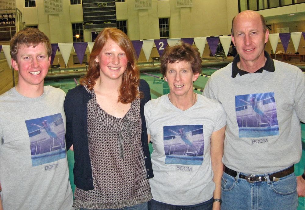 Amherst College star swimmer Kendra Stern with her brother Connor, mother Mimi, and father Walter (l to r) after a meet at Amherst’s Pratt Pool in January. (Doug Tribou/WBUR)