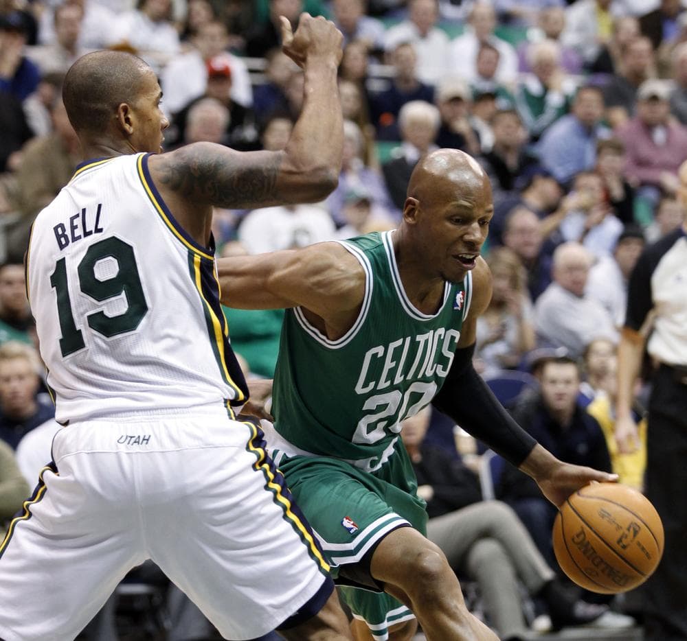 Boston Celtics guard Ray Allen (20) drives around Utah Jazz guard Raja Bell (19) during the first half of the game in Salt Lake City on Monday. (AP)