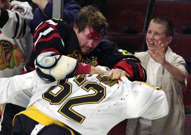 Chicago Blackhawks' Bob Probert and Boston Bruins' Andrei Nazarov (62) fight along the boards during a game on Oct. 28, 2001 in Chicago. Probert died of a heart attack last summer at the age of 45. (AP)