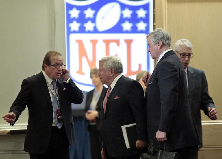 New England Patriots owner Robert Kraft, second from left, leaves NFL labor negotiations with the owners delegation Wednesday. (AP)