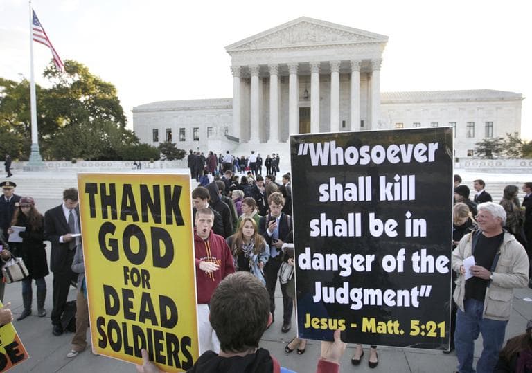 Westboro Baptist Church members in front of the Supreme Court in Washington, D.C., holding signs they take to their protests of military funerals. The Supreme Court ruled Wednesday in favor of protesters right to free speech. (AP/Carolyn Kaster) 