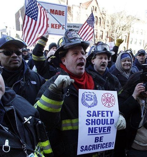 Elizabeth Fire Department firefighters in Trenton, N.J., protest staff cuts and promote public safety. (AP)