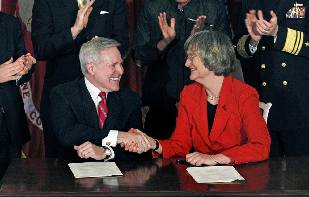 Navy Secretary Ray Mabus, left, shakes hands with Harvard University President Drew Gilpin Faust after signing an agreement on Friday that will recognize the Naval ROTC's formal presence on campus. (AP)